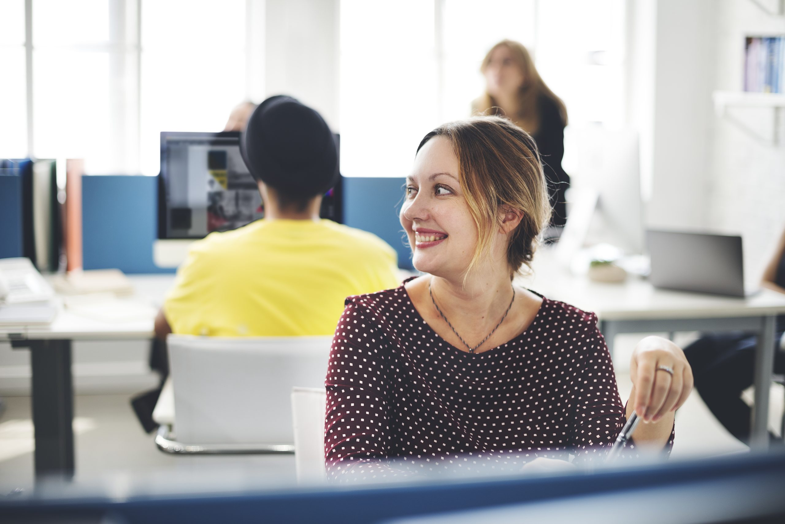 Closeup Of Cheerful Caucasian Woman Working At Office