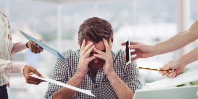 Stressed Man Frustrated With Electronic Devices
